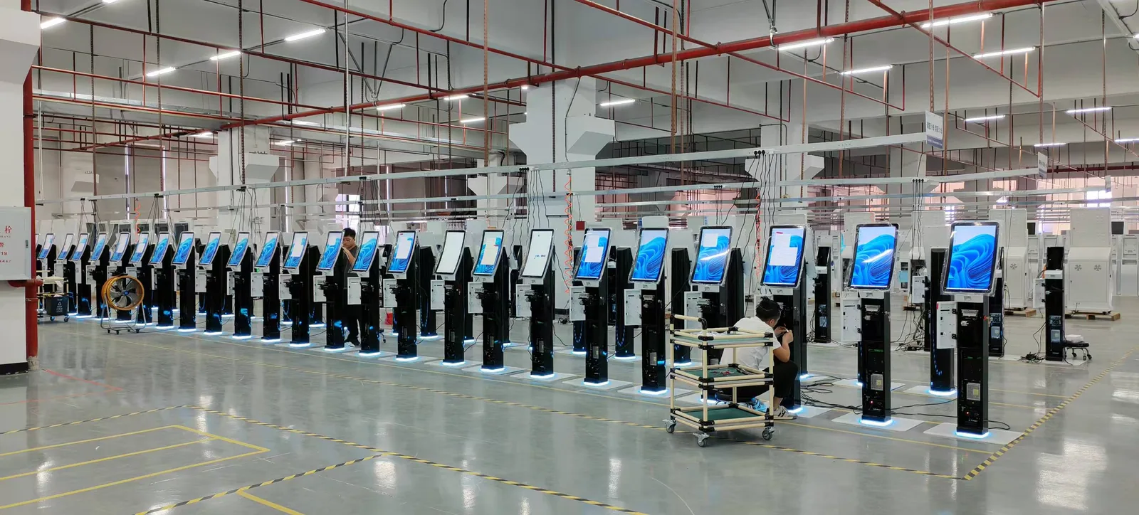 Attraction ticketing kiosks assembled in rows on the production line
